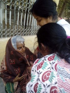 Providing  a warm shawl to an eldlery lady